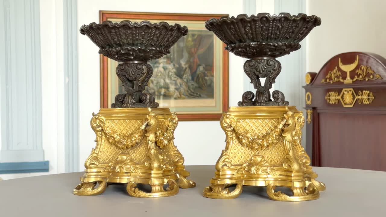 PAIR OF GILT AND PATINATED BRONZE CUPS, 19TH CENTURY